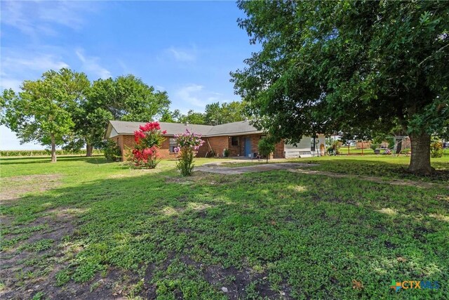 2080 Allison Rd, Martindale, TX 78655 - view of front of home with a front lawn
