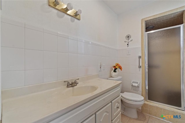 2080 Allison Rd, Martindale, TX 78655 - bathroom with a shower stall, vanity, tile walls, and tile patterned floors