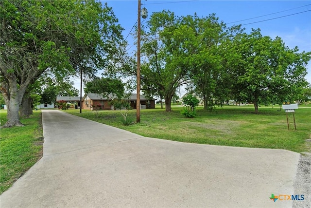 2080 Allison Rd, Martindale, TX 78655 - obstructed view of property featuring driveway and a front lawn