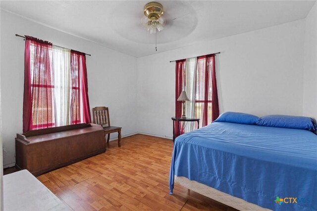 2080 Allison Rd, Martindale, TX 78655 - bedroom with wood finished floors and a ceiling fan