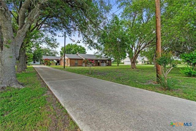 2080 Allison Rd, Martindale, TX 78655 - ranch-style house featuring driveway and a front yard