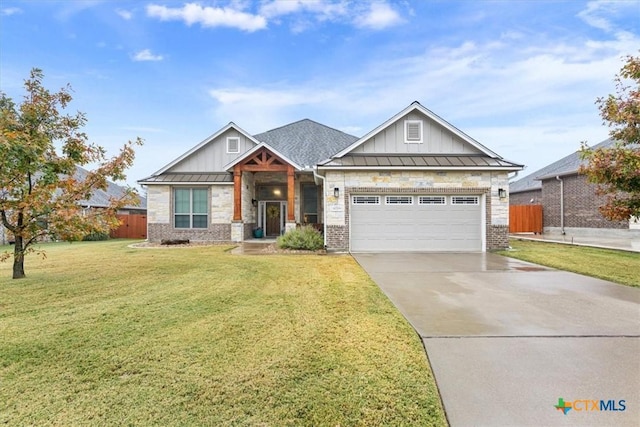 craftsman-style home featuring a garage and a front yard