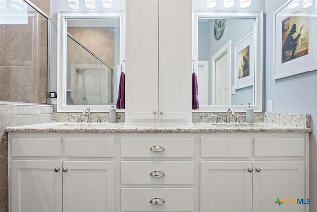 bathroom with vanity and an enclosed shower