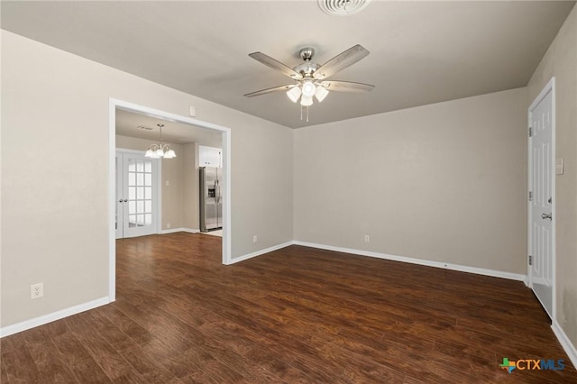 3102 Taft St, Killeen, TX 76543 - unfurnished room featuring ceiling fan, a chandelier, dark wood-style flooring, and baseboards