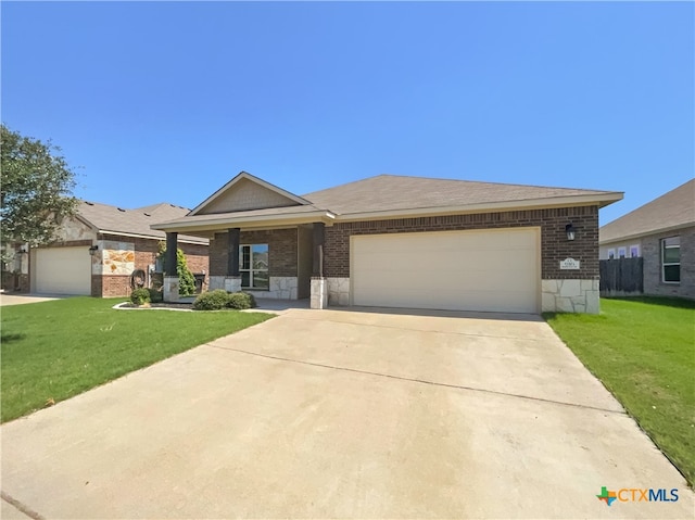 ranch-style home with a garage and a front yard