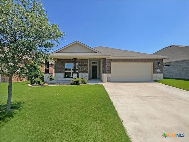 view of front of property with a garage, a front yard, and a porch