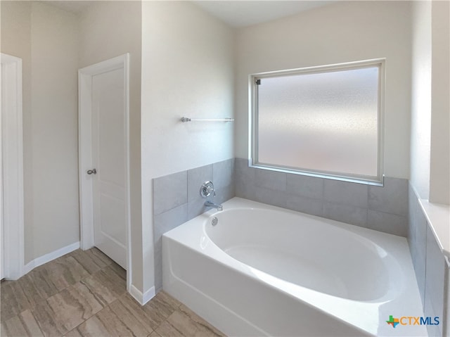 bathroom featuring a washtub