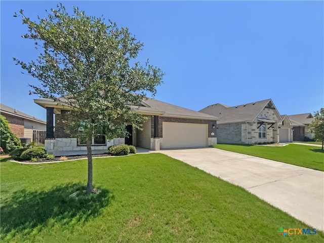 ranch-style house featuring a garage and a front yard