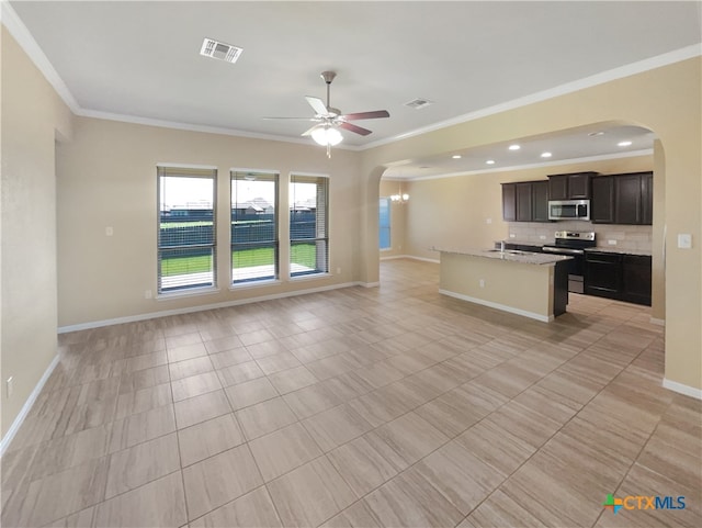 unfurnished living room featuring sink, ornamental molding, and ceiling fan with notable chandelier