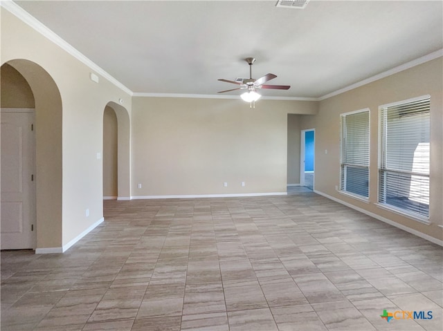 spare room with ceiling fan and ornamental molding