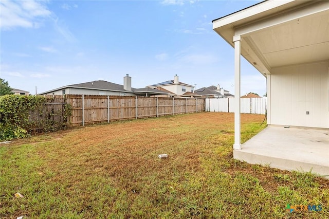 view of yard with a patio area and a fenced backyard