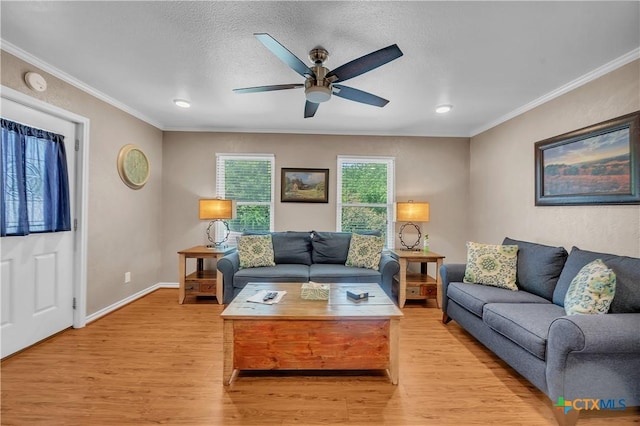 living room with a ceiling fan, crown molding, light wood-type flooring, baseboards, and recessed lighting