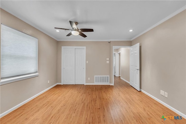 unfurnished bedroom with recessed lighting, visible vents, light wood-type flooring, crown molding, and baseboards