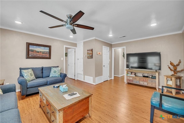 living area featuring a ceiling fan, light wood finished floors, ornamental molding, visible vents, and recessed lighting