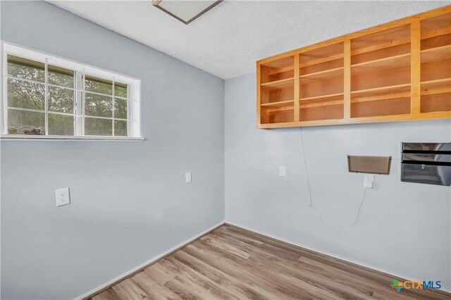 1009 E Robertson Ave, Copperas Cove, TX 76522 - unfurnished room with wood finished floors and baseboards
