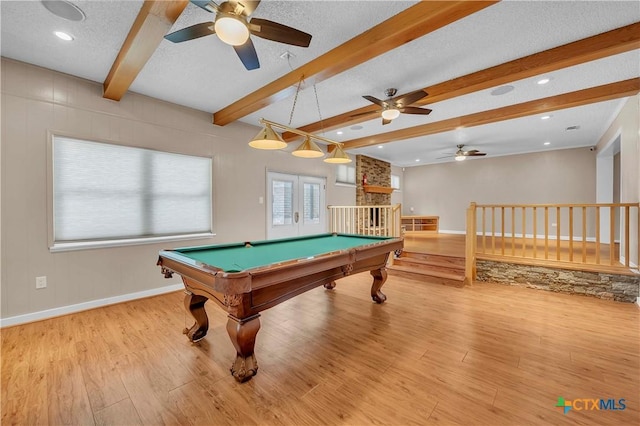 rec room with billiards, beamed ceiling, wood finished floors, and ceiling fan