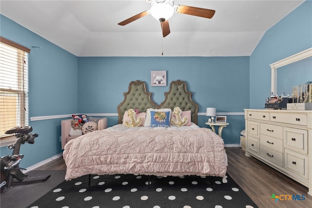 bedroom featuring vaulted ceiling, wood finished floors, and baseboards