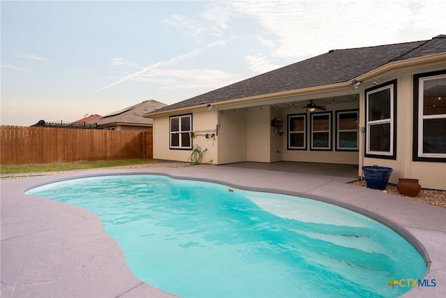 view of swimming pool with a fenced in pool, a patio area, and fence