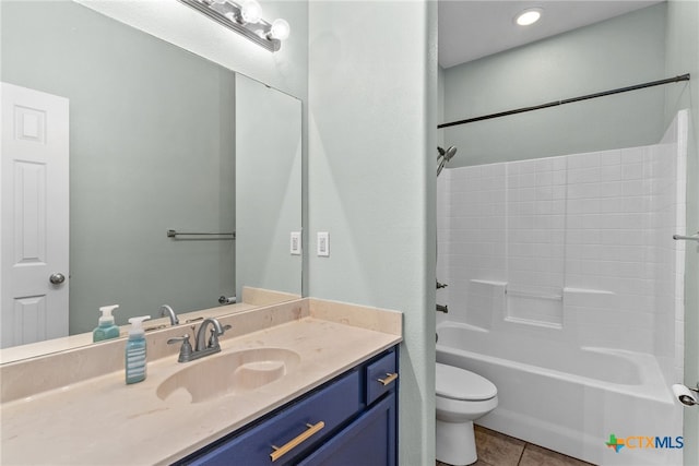 full bathroom featuring tile patterned flooring, bathtub / shower combination, vanity, and toilet