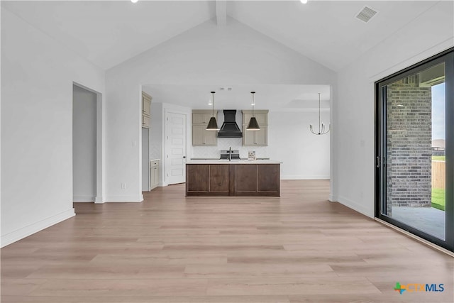 4018 Prairie Dr, Nolanville, TX 76559 - unfurnished living room featuring light wood-type flooring, healthy amount of natural light, a chandelier, and recessed lighting