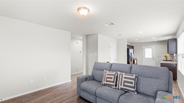 9741 Sandy Ridge Way, San Antonio, TX 78239 - living room with wood finished floors and recessed lighting