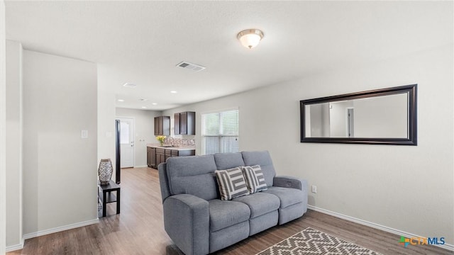 9741 Sandy Ridge Way, San Antonio, TX 78239 - living area featuring wood finished floors and recessed lighting