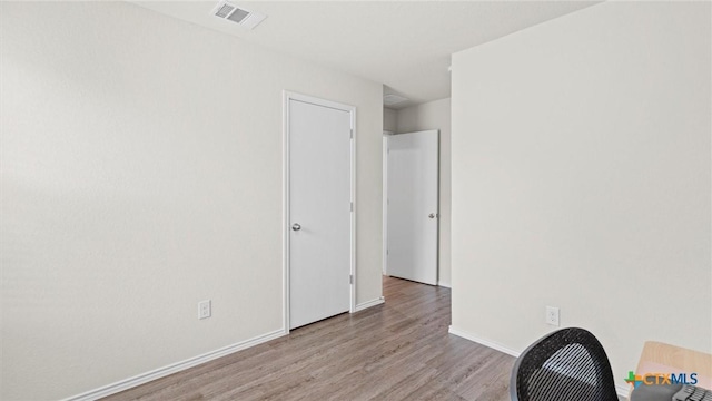 9741 Sandy Ridge Way, San Antonio, TX 78239 - empty room with wood finished floors and baseboards
