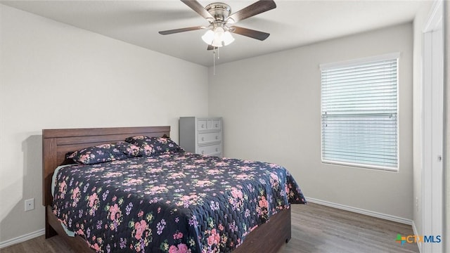 9741 Sandy Ridge Way, San Antonio, TX 78239 - bedroom featuring wood finished floors and a ceiling fan