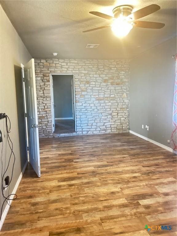 unfurnished room featuring ceiling fan and wood-type flooring