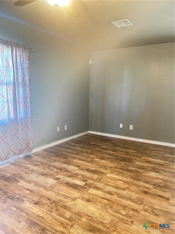 spare room with hardwood / wood-style flooring