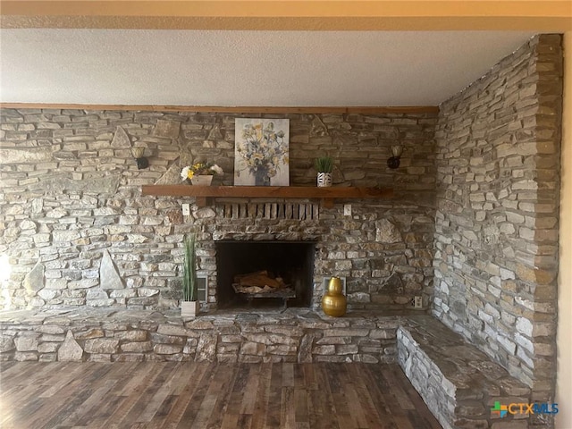 interior details featuring wood-type flooring and a textured ceiling