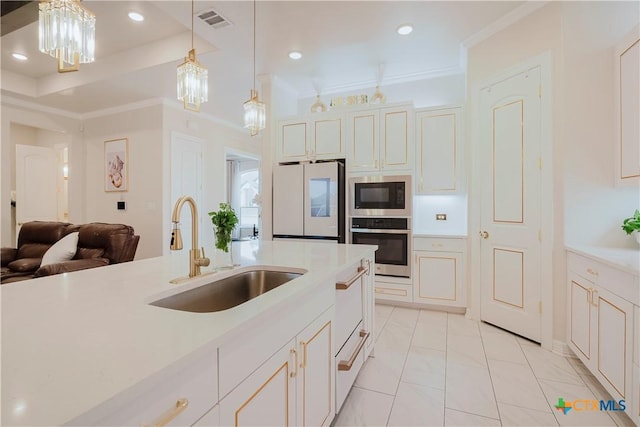 kitchen featuring stainless steel oven, black microwave, sink, pendant lighting, and white refrigerator