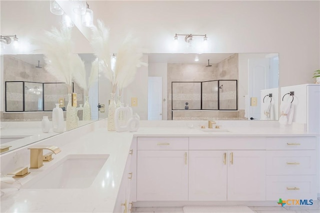 bathroom featuring vanity and tiled shower