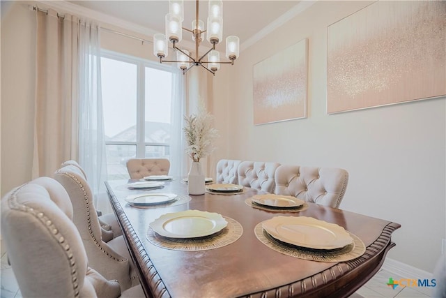 dining room featuring ornamental molding and an inviting chandelier