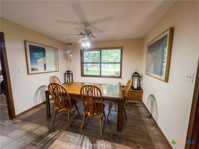 dining area with baseboards, wood finished floors, and a ceiling fan