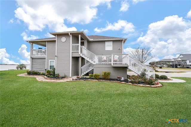 back of property featuring a lawn