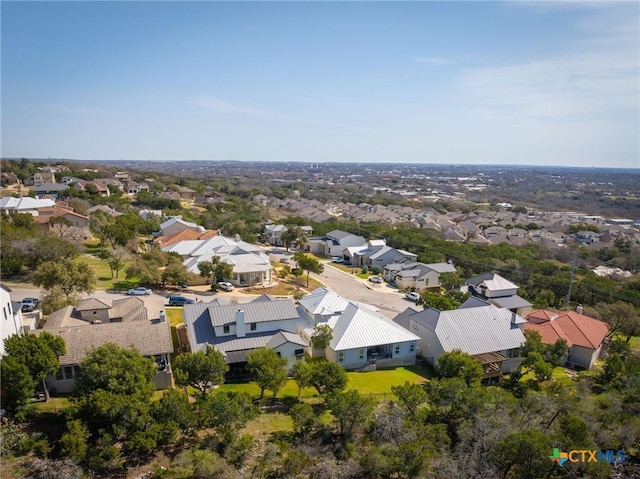 birds eye view of property with a residential view