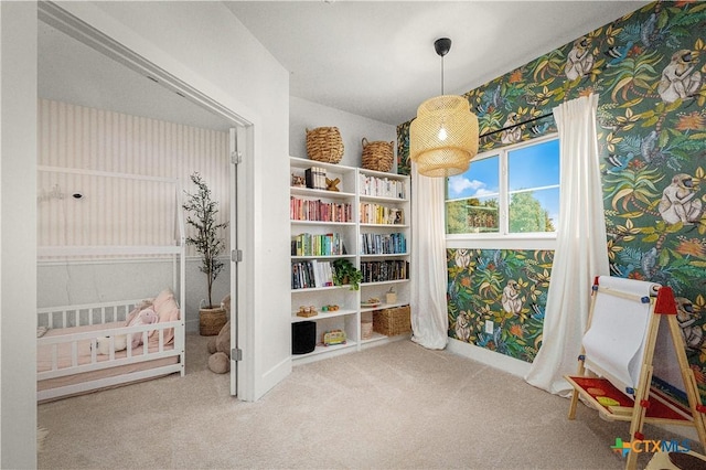 interior space featuring wallpapered walls, carpet, and baseboards