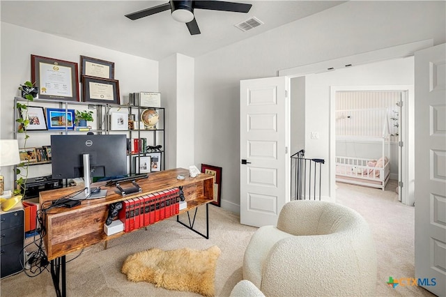 office area with ceiling fan, carpet floors, and visible vents