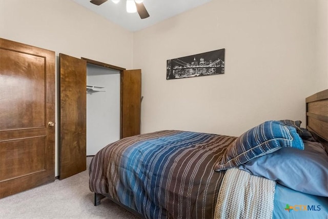 bedroom featuring ceiling fan and light colored carpet