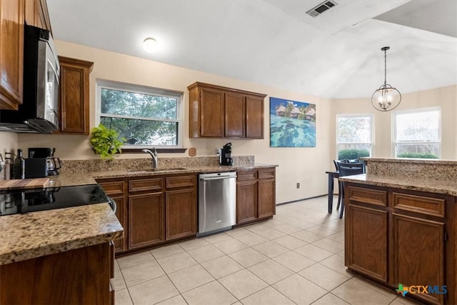 kitchen featuring stainless steel appliances, a healthy amount of sunlight, sink, and decorative light fixtures