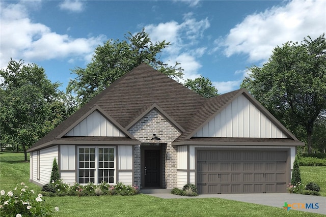 view of front of property with a garage and a front yard