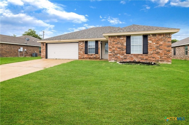 3206 Ida Dr, Killeen, TX 76549 - ranch-style home with concrete driveway, a front yard, brick siding, an attached garage, and a shingled roof