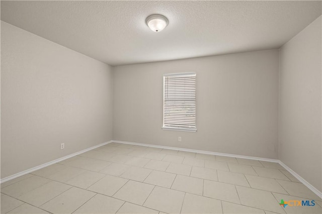 3206 Ida Dr, Killeen, TX 76549 - spare room with a textured ceiling and baseboards