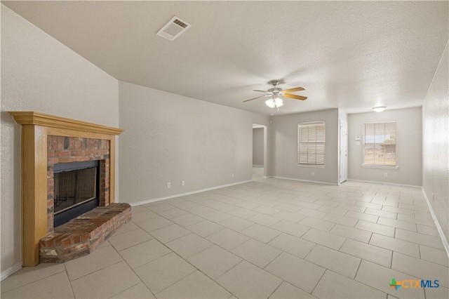 3206 Ida Dr, Killeen, TX 76549 - unfurnished living room with a ceiling fan, a brick fireplace, and light tile patterned floors