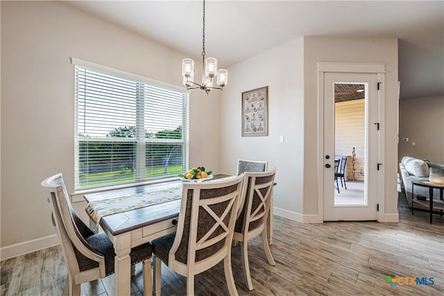 8508 Mount Nebo Cir, Belton, TX 76513 - dining area featuring a chandelier, baseboards, and light wood finished floors