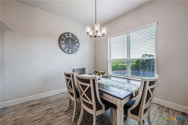 8508 Mount Nebo Cir, Belton, TX 76513 - dining area featuring baseboards, a chandelier, and wood finished floors
