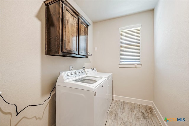 8508 Mount Nebo Cir, Belton, TX 76513 - laundry area with cabinet space, separate washer and dryer, light wood-type flooring, and baseboards