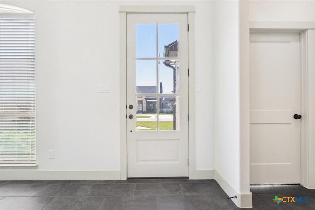 124 Cumberland Dr, Belton, TX 76513 - entryway with baseboards, dark tile patterned floors, and plenty of natural light