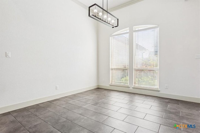 124 Cumberland Dr, Belton, TX 76513 - unfurnished dining area with tile patterned flooring, baseboards, an inviting chandelier, and ornamental molding
